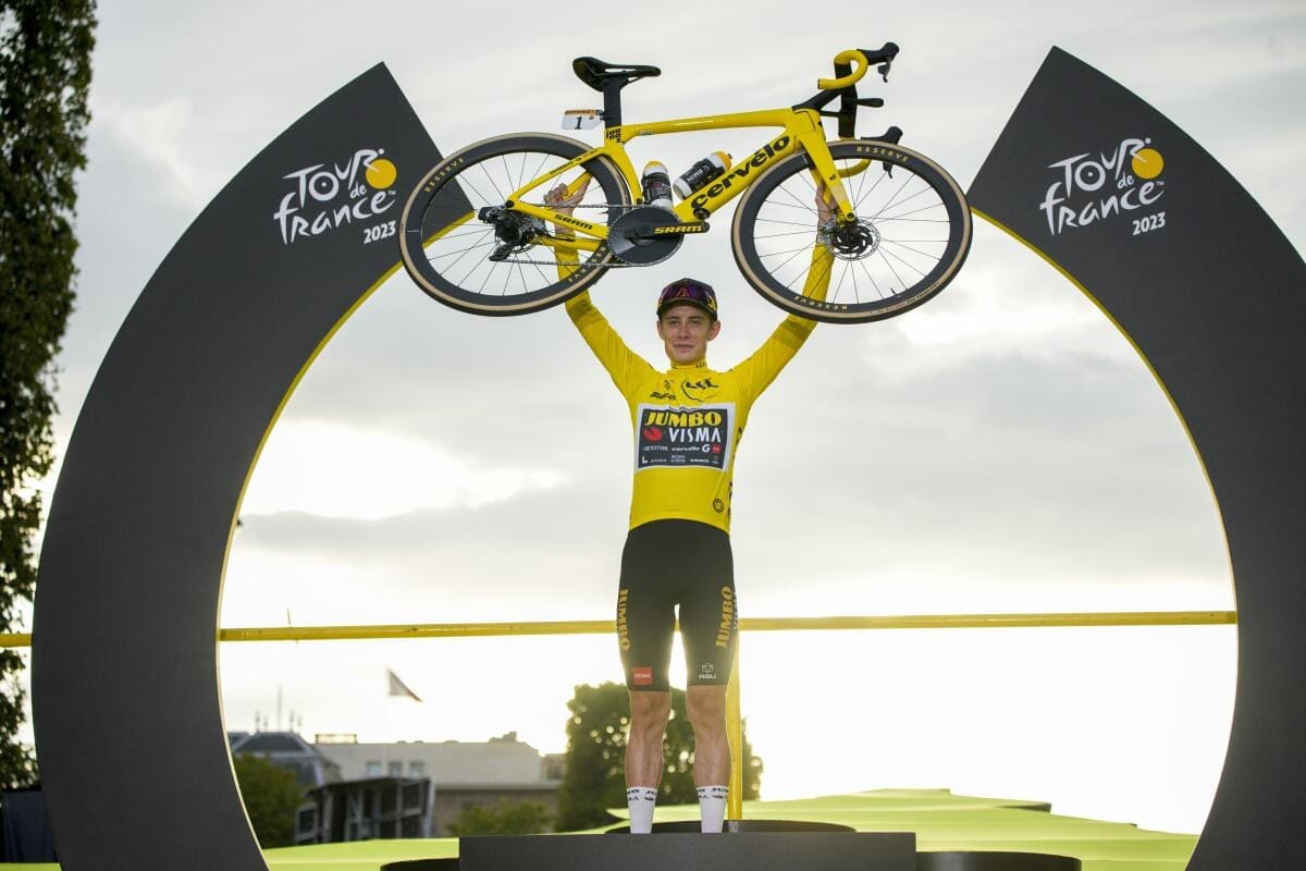 Tour de France Winners Cyclist celebrating victory with bicycle